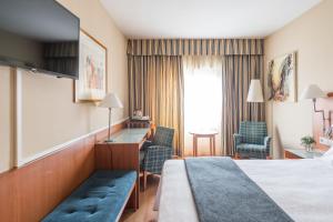 Postel nebo postele na pokoji v ubytování Up Rooms Vic Hotel + 37 fotografií