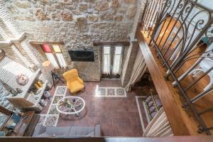 an overhead view of a living room with a staircase at Villa Galanoussa in Zakynthos