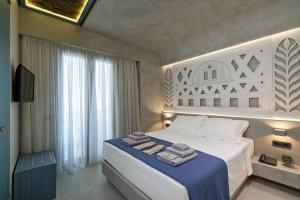 Posteľ alebo postele v izbe v ubytovaní Estia Boutique Apartments + 37 fotografií