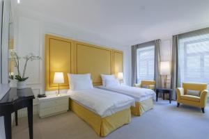 Postel nebo postele na pokoji v ubytování Boutique Hotel Corso + 37 fotografií