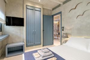 Posteľ alebo postele v izbe v ubytovaní Estia Boutique Apartments