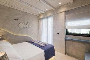 Posteľ alebo postele v izbe v ubytovaní Estia Boutique Apartments