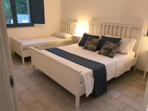 Ένα ή περισσότερα κρεβάτια σε δωμάτιο στο Casale Scirbia