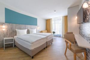 Letto o letti in una camera di Michels Gästehaus Meerzeit