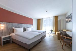 Letto o letti in una camera di Michels Gästehaus Meerzeit