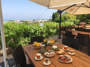 a wooden table with food on top of a table at Agriturismo del Sole in Anacapri