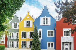 a row of houses painted in different colors at Madame L & SPA in Svetlogorsk