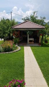 a garden with a gazebo and a pathway at Guest House Adrijana in Seliste Dreznicko