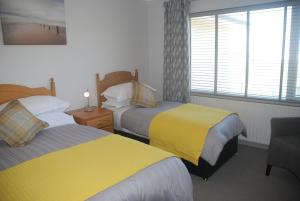Letto o letti in una camera di Tuskar House by the Sea