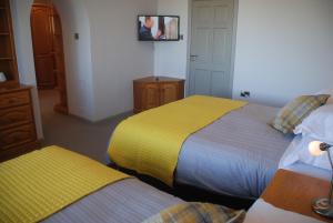 Letto o letti in una camera di Tuskar House by the Sea