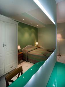 Un pat sau paturi într-o cameră la Il Casale Corte Rossa