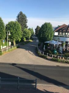 an empty street with a building and an umbrella at Julia in Zingst