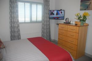 Letto o letti in una camera di Tuskar House by the Sea