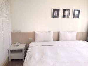 Voodi või voodid majutusasutuse Wemeet Hotel Taipei toas