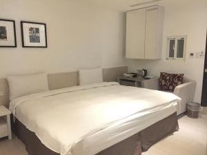 Voodi või voodid majutusasutuse Wemeet Hotel Taipei toas