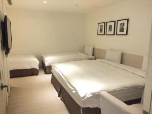 Voodi või voodid majutusasutuse Wemeet Hotel Taipei toas