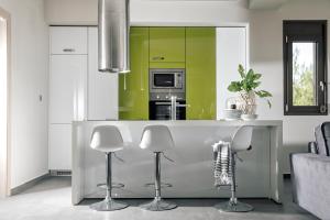 A kitchen or kitchenette at Bellevue Villas with private pool