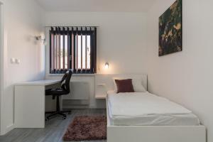 Postel nebo postele na pokoji v ubytování Villa Panorama
