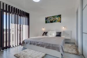 Postel nebo postele na pokoji v ubytování Villa Panorama