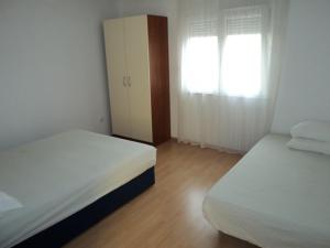 Posteľ alebo postele v izbe v ubytovaní Dragica Vukaševič