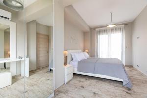 A bed or beds in a room at Bellevue Villas with private pool