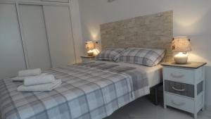 Кровать или кровати в номере Casas Holiday - Playa del Cura 1