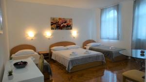 Postel nebo postele na pokoji v ubytování Guest House Mamut