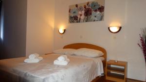 Postel nebo postele na pokoji v ubytování Guest House Mamut
