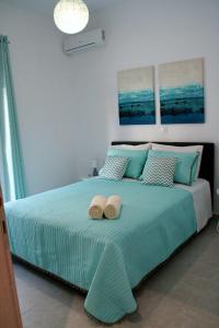 Postel nebo postele na pokoji v ubytování Orama Suites II