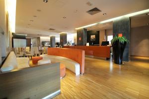 a lobby of a hotel with a waiting room at Hotel Major in Ronchi dei Legionari