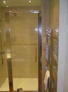 a shower with a glass door in a bathroom at Hillside Bed & Breakfast in Kendal +35 photos