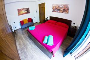 A bed or beds in a room at B&B Selvarossa