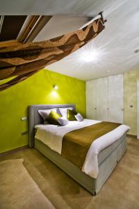 Ένα ή περισσότερα κρεβάτια σε δωμάτιο στο B&B Villa Curtricias
