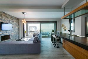 A television and/or entertainment centre at Bellevue Villas with private pool