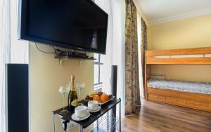 TV a/nebo společenská místnost v ubytování Hotel Fusion