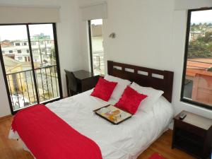 Rúm í herbergi á B&B Hostel CasaMoro