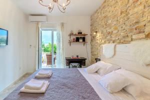 Posteľ alebo postele v izbe v ubytovaní Apartments Rija