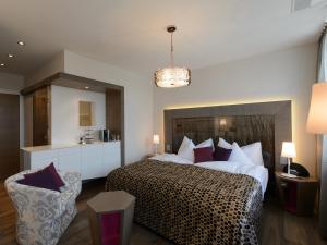 a bedroom with a large bed with a cheetah bedspread at Hotel-Restaurant-Schifflände in Birrwil