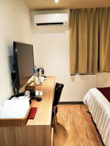 Voodi või voodid majutusasutuse Dahshin Hotel toas