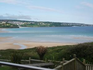 a view of a beach with the ocean in the background at The Penellen guest accommodation room only in Hayle