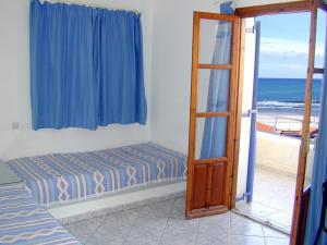 Postel nebo postele na pokoji v ubytování Mike's Beach Apartments & Studios