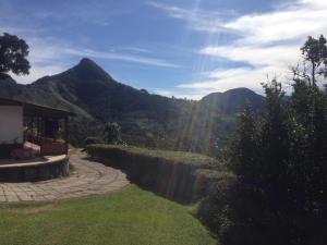 a view of the mountains from a house at Canto dos Pássaros in Nova Friburgo