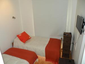 Rúm í herbergi á B&B Hostel CasaMoro