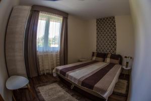 Posteľ alebo postele v izbe v ubytovaní Aqua Line Apartmanház
