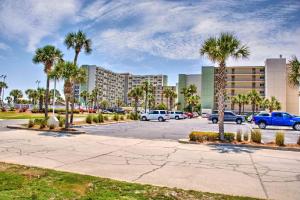 a parking lot with palm trees and a building at Pinnacle Port B3-307 in Carillon Beach