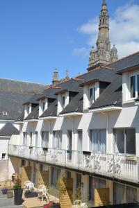 a large white building with a black roof at L'Auberg'ine - Maison Glenn Anna in Sainte Anne d'Auray 