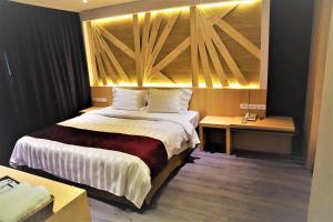 Voodi või voodid majutusasutuse Dahshin Hotel toas