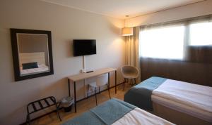 Кровать или кровати в номере Hotel Kivitasku