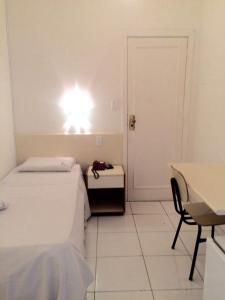 Ένα ή περισσότερα κρεβάτια σε δωμάτιο στο Hotel Pampulha Palace