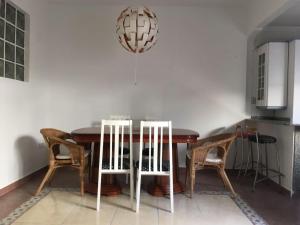 a dining room with a wooden table and chairs at Malvarrosa Calle Pavia in Valencia